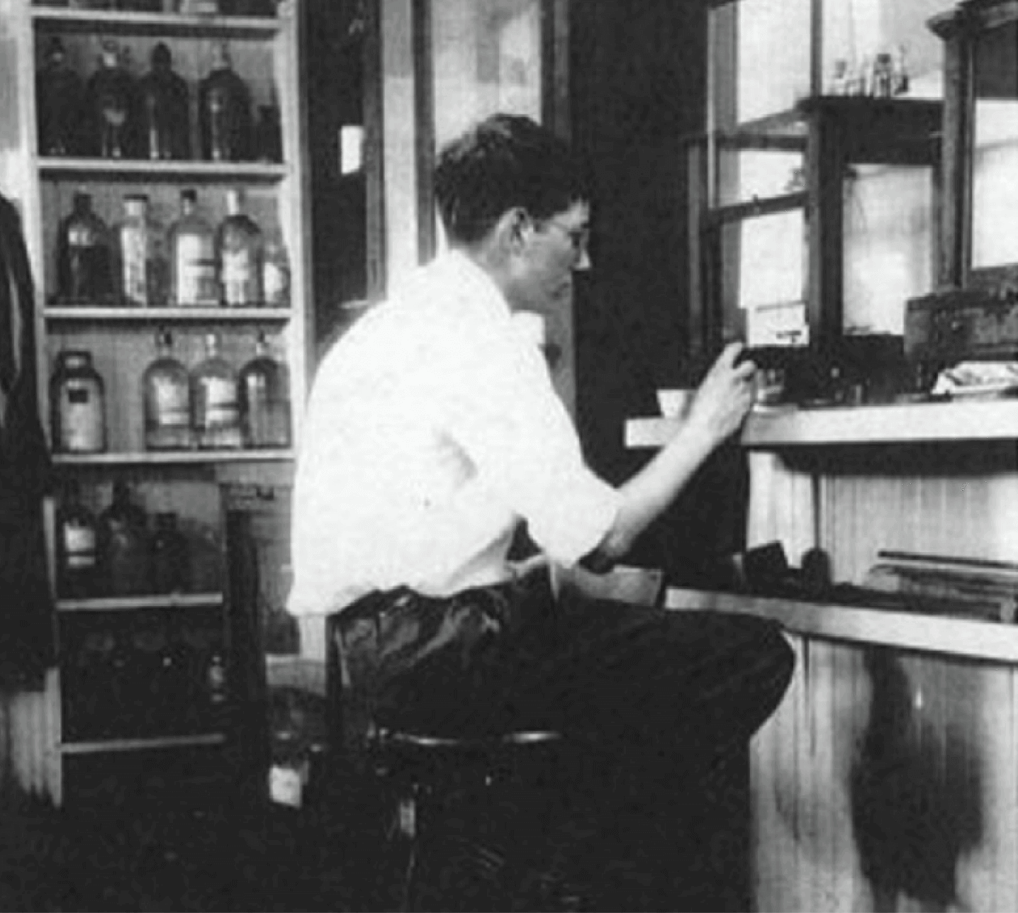black and white photo of art babson working in a laboratory